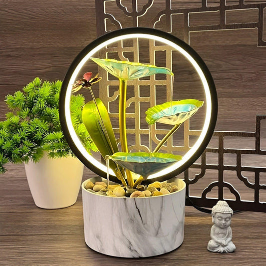 Tischlampe mit elegantem Wasserfall-Design und LED-Lichtring.